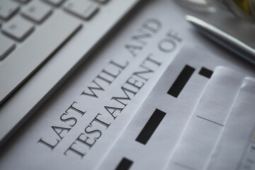 Close-up of Last Will and Testament Document with Keyboard and Pen on Desk