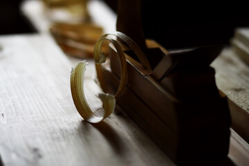 Plane jointer carpenter or joiner tool and wood shavings. Woodworking tools on wooden table....