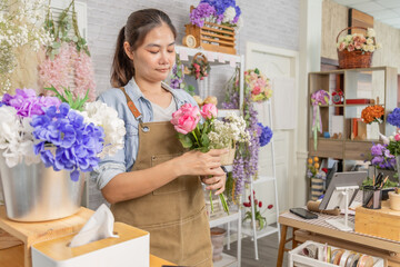 Florist shopkeeper small business owner arranging rose flowers with professional skills, organizing workspace, creative floral design process, growing boutique business modern retail florist business