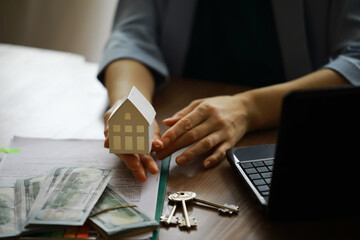 Real estate agent talked the terms of the home purchase agreement and asked the customer to sign the documents, Home sales and insurance concept.