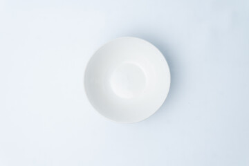 Clean minimalist white bowl from above. Perfect for food presentation, culinary mockups, and healthy eating concepts in a bright studio setting.

