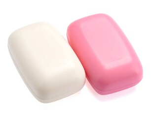 Two rectangular bars of personal cleansing products, one white, one pink, sit close together on a white backdrop