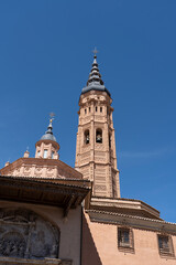 Fototapeta premium Tall church tower against a clear blue sky.. Collegiate Church of Santa María la Mayor, in Calatayud, Spain