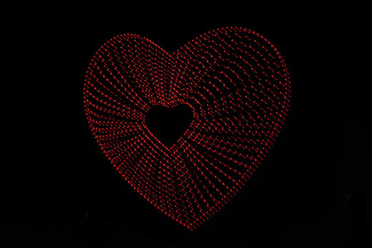 a red drone heart made with various drones
differed drones makes a hart figure in the air