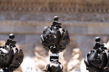 Decorative ironwork with intricate designs and textures.. Collegiate Church of Santa María la...
