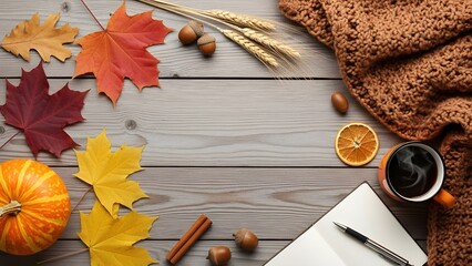 Autumn seasonal flat lay with colorful leaves and pumpkins on wooden background