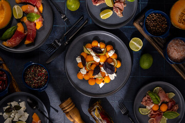 Elegant melon appetizer with prosciutto and fresh ingredients