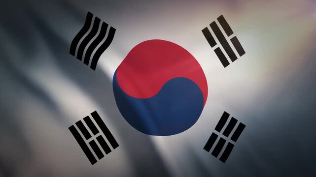 Waving flag of South Korea, also known as Taegeukgi, with its distinctive red and blue yin-yang symbol and four black trigrams.