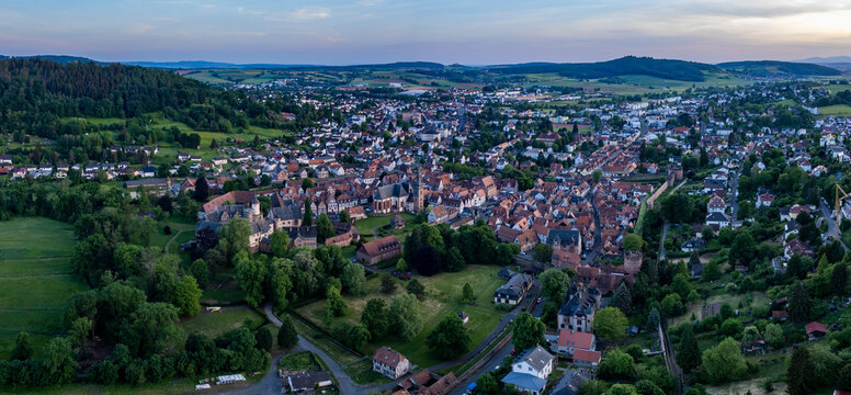 Aerial panoramic view of the city and castle B&uuml;dingen, 63654 in Germany on a sunny spring afternoon.