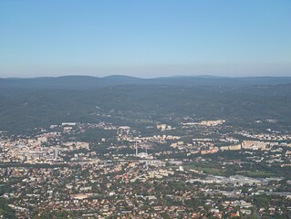 Fototapeta premium aerial view of historic urban layout, heritage town layout amid hills with green surroundings
