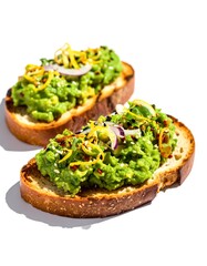 Two slices of toasted bread topped with mashed green avocado and garnished with red onions and black sesame seeds