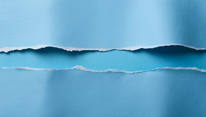 two strips of light blue textured paper reveal a paler surface underneath with rough torn edges