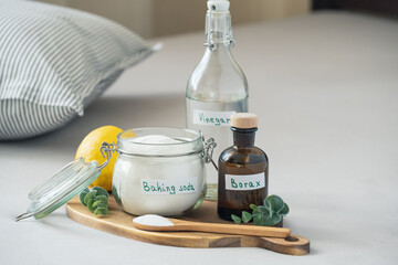 Natural eco-friendly pillow cleaning concept using baking soda, vinegar, salt and borax. Sustainable, non-toxic home care solution for fresh and hygienic bedding. Zero waste concept.