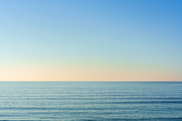 Beautiful summer seascape with clouds and a clear blue sky, background for summer vacation concept.