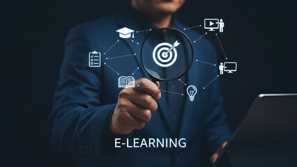Businessman examining digital e-learning goals and educational concepts through a magnifying glass with technology icons connected.