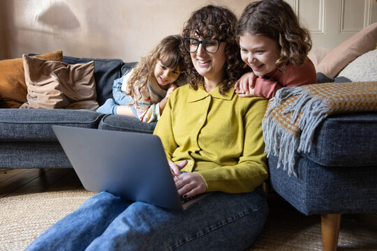 Family Bonding Moments with a Laptop Device