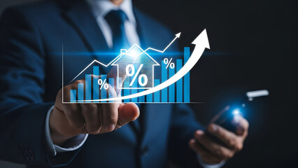 Businessman interacting with glowing digital chart showing rising interest rates and housing market growth projections
