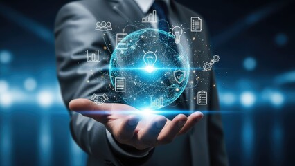 Businessman holding glowing global network sphere with data icons.