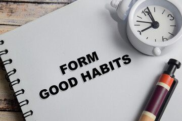 Concept of form good habits write on book isolated on Wooden Table.