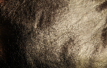 Bronze Leather Texture with Metallic Shimmer: Detailed Macro Shot of Material for Backgrounds, Design, and Fashion Industry.