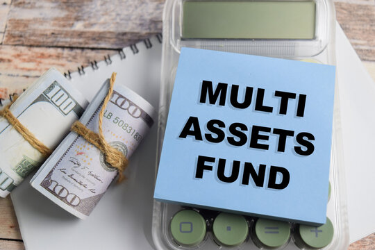 Concept of multi assets fund write on sticky notes isolated on Wooden Table.