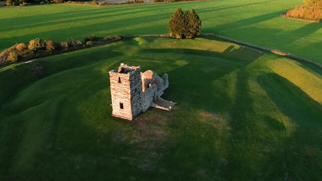 Church Henge. Part of Knowlton Rings Neolithic and Bronze Age earthworks, Dorset. 12th C Knowlton Church central. Great Barrow at 2 o&rsquo;clock. View to NE.  Video fly out up