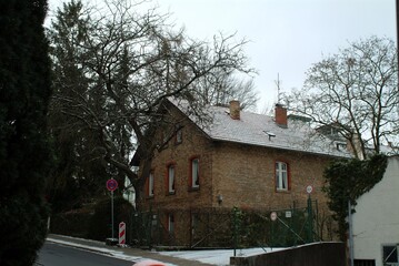 Peaceful rustic house amid winter landscape, Calm countryside scene with snow and aged brickwork Keukenhof, Holland April ,