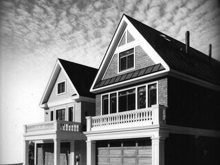 Black and White Image of Modern Houses with Balconies and Garages