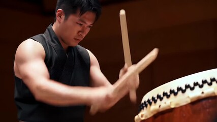 Intense Taiko Drum Performance: Energetic Musician Showcasing Traditional Japanese Art