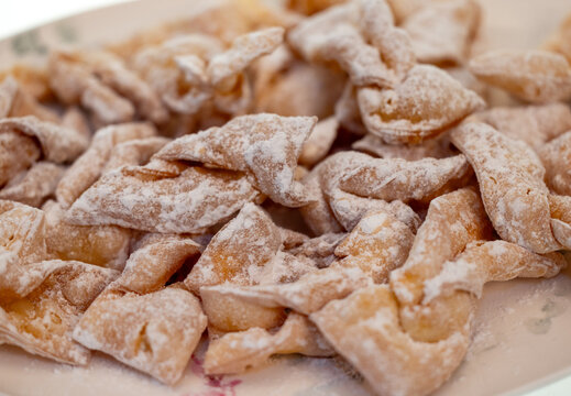 Angel wings (Faworki), cakes. Sweet pastry deep fried and sprinkled with powdered sugar