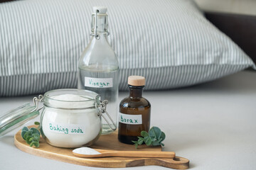 Natural eco-friendly pillow cleaning concept using baking soda, vinegar, salt and borax. Sustainable, non-toxic home care solution for fresh and hygienic bedding. Zero waste concept.