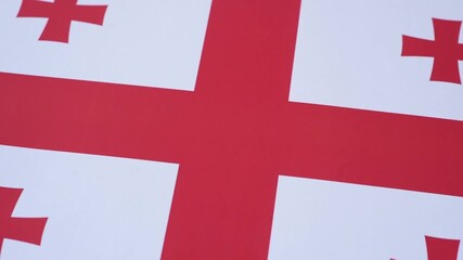 Georgia, the Georgian red and white flag as a symbol of independence and freedom. The Georgian flag as a background for your design
