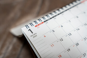 A close-up of a desk calendar displaying January 1, 2026, indicating the start of a new year....