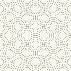 Vector seamless pattern. Stylish linear ornament with geometric arches. Regular monochrome texture featuring a grid of concentric semicircles. Basic essential surface design.