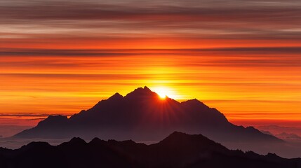 A breathtaking sunset over majestic mountains, showcasing brilliant hues of orange and purple, Ideal for travel brochures, nature calendars, and inspirational quotes about adventure and exploration,