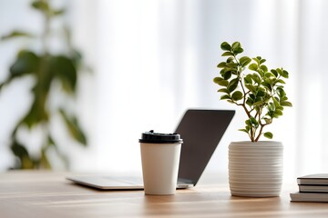 Home office setup coffee laptop and plant in a bright workspace modern ambiance close-up view