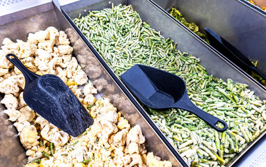 Frozen vegetables are sold at the grocery store. A good natural product for fast cooking delicious food