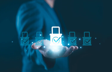 Businessman holding glowing secure padlock icons representing data protection, cybersecurity, digital privacy, secure access, information safety, and online security technology for modern business 