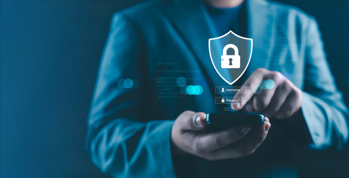 Business person using smartphone with secure login interface, shield and padlock icon representing mobile cybersecurity, user authentication, password protection, digital privacy and secure online - Powered by Adobe