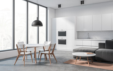 Fototapeta premium Modern kitchen interior with white cabinets, wood-accented dining furniture, and cozy living space, in minimalist design on light background. 3D Rendering