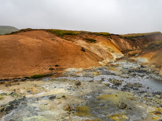 Kr&yacute;suv&iacute;k-Selt&uacute;n Geothermal Hot Springs, known as Selt&uacute;nshverir or Kr&yacute;suv&iacute;kurhverir, yellow-orange sulphur smell volcanic area, solfataras, bubbling mud pools, fumaroles. Reykjanes peninsula, Iceland.