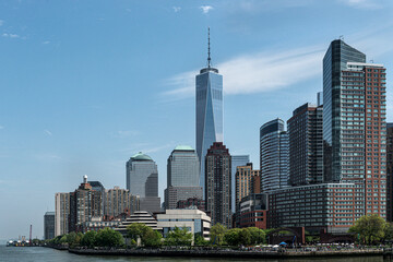 One world trade center dominating new york city skyline on sunny day