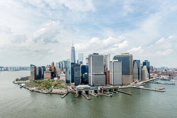 Lower manhattan skyline with one world trade center dominating over battery park and the hudson river