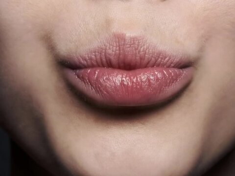 Attractive Female Lips Close-Up with Natural Texture and Soft Beauty Makeup