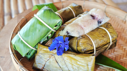 Khao Tom Mud, Traditional Thai dessert sticky rice, coconut milk and banana wrapped in banana leaves