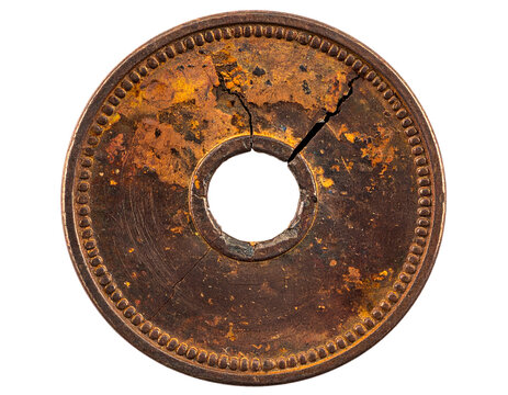 Rusty cracked metal washer disk with center hole, corroded industrial hardware ring macro texture on isolated background
