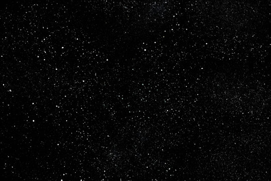 Chaotic white star bokeh on a isolated black background. falling blurry bokeh snow overlay, starry sky. white spots on black background, white drops and spots. abstraction. - Powered by Adobe