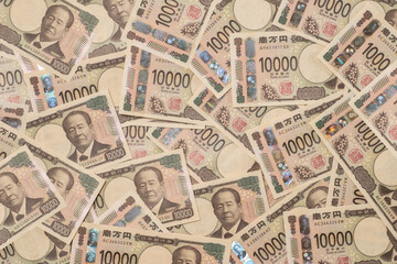 敷き詰められた多数の一万円札