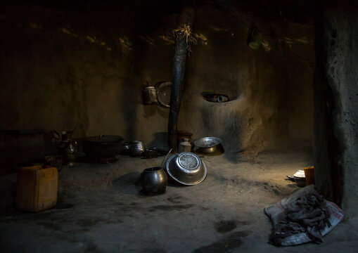 Afghan girl inside a traditional pamiri kitchen, Badakhshan province, Khandood, Afghanistan