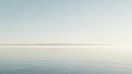 Fototapeta premium A serene ocean landscape with a calm sea and clear sky